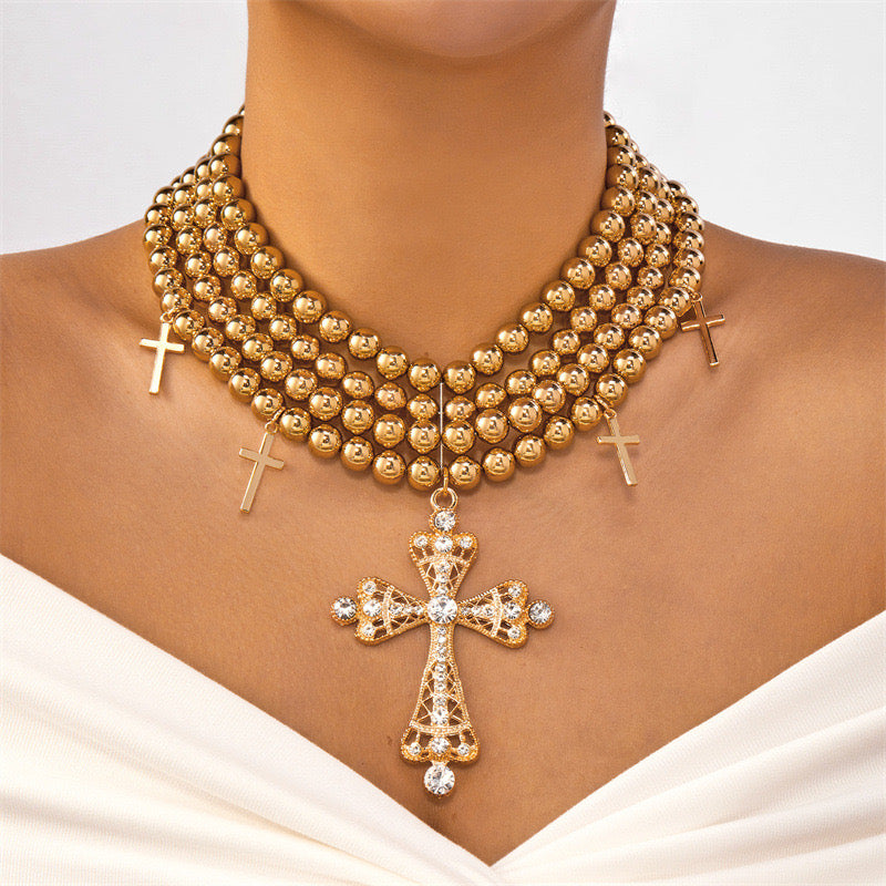 “Gold Studded Cross”